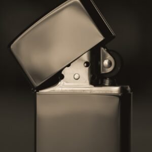 a black and white photo of a lighter